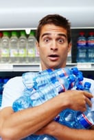 man holding water bottlesiStock_000017481624Small